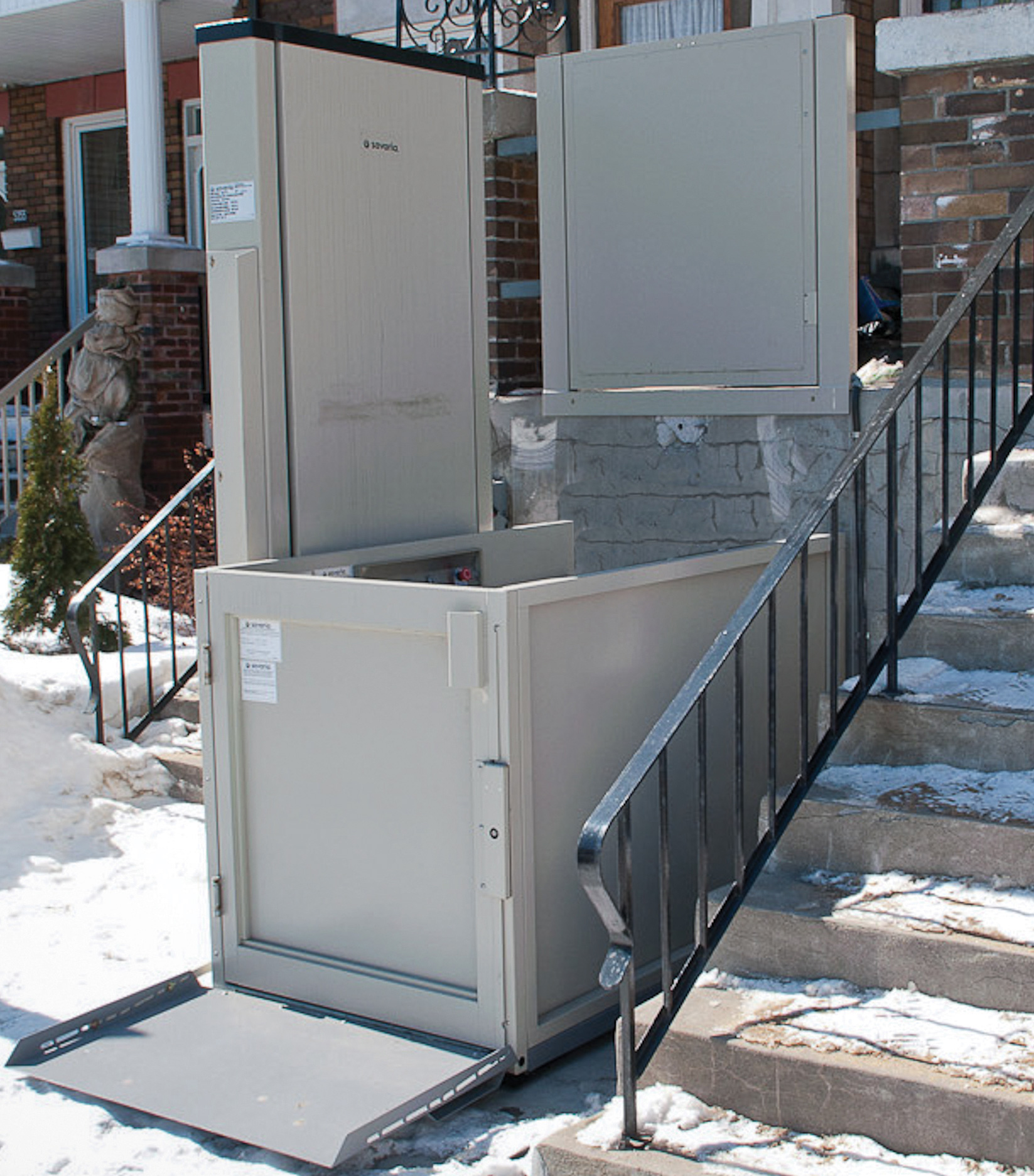 Wheelchair lift features, folding access ramp and lower landing gate