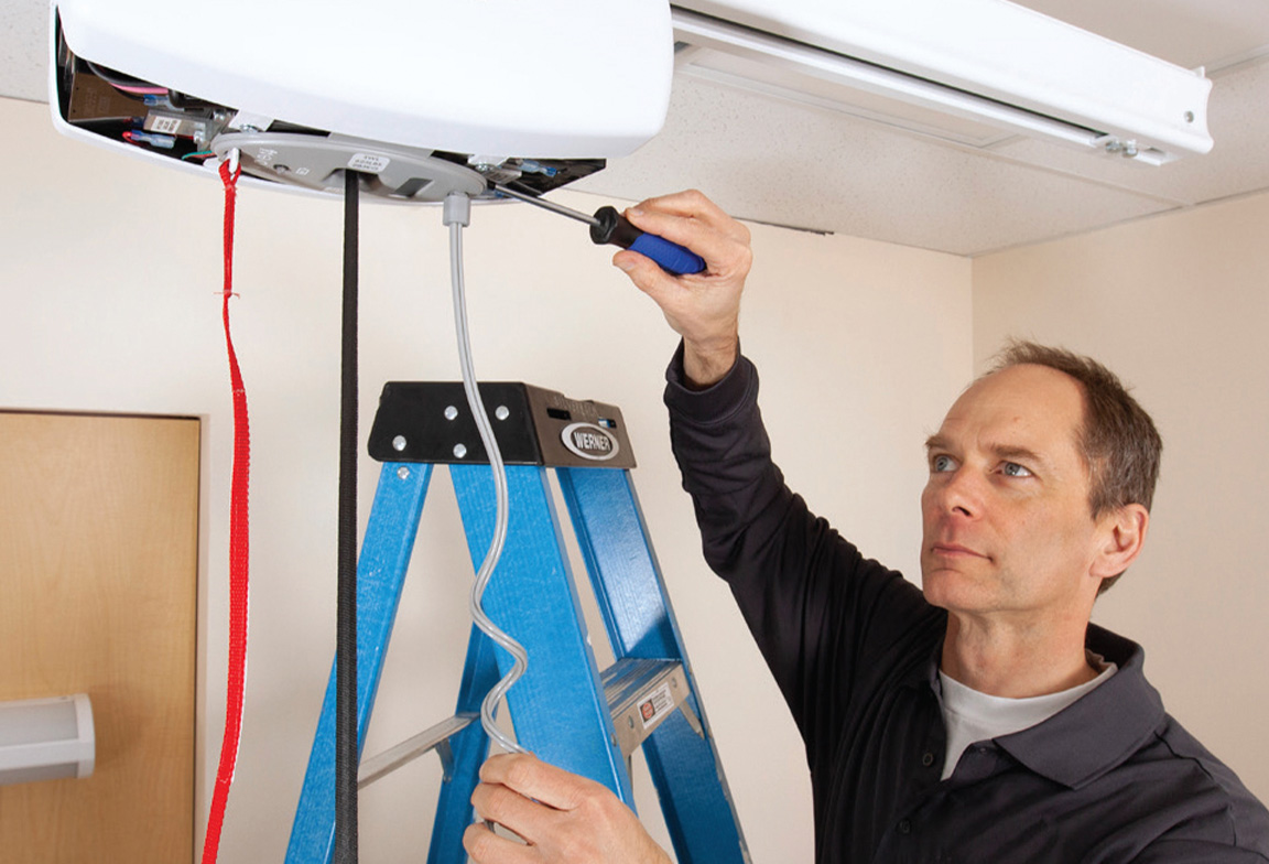 Man installing a fixed ceiling lift