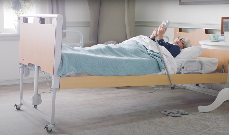 Woman in medical bed in Trendelenburg position