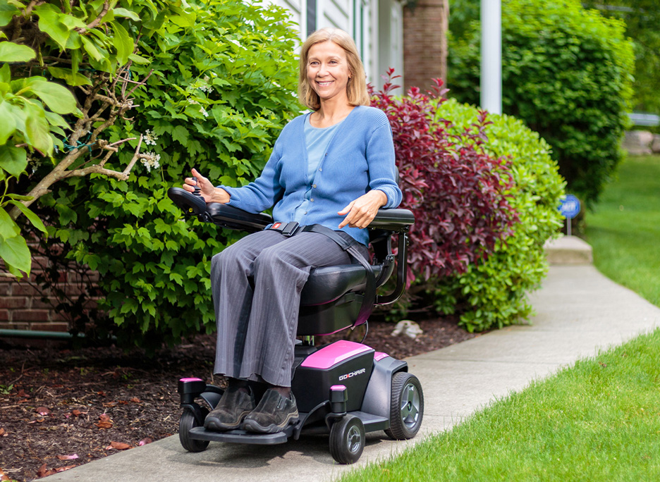 Power wheelchair in use on sidewalk